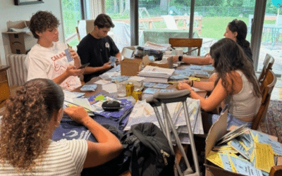 Volunteers help assemble Core Reporter kits